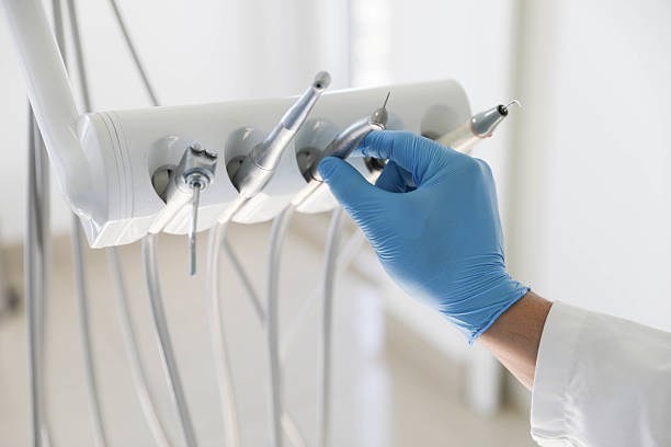 Professional Tooth Extraction technician working in East Moline, IL